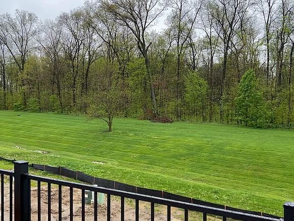 Backs up yo 16 acre wooded area with trails