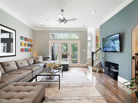The spacious 20â x 16â open concept second floor living with plenty of light, beautiful white oak hardwood floors, and five-speaker surround sound mounted in the ceiling.