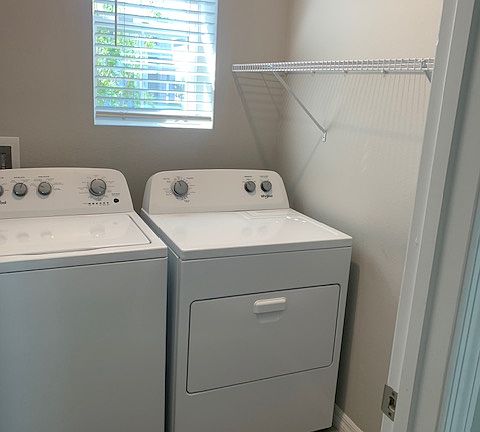 Laundry room with washer and dryer included