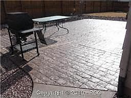 Huge stamped concrete patio accessible for grilling 