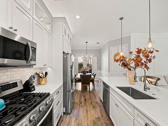 Open concept living space. Kitchen with high-end appliances and finishes.