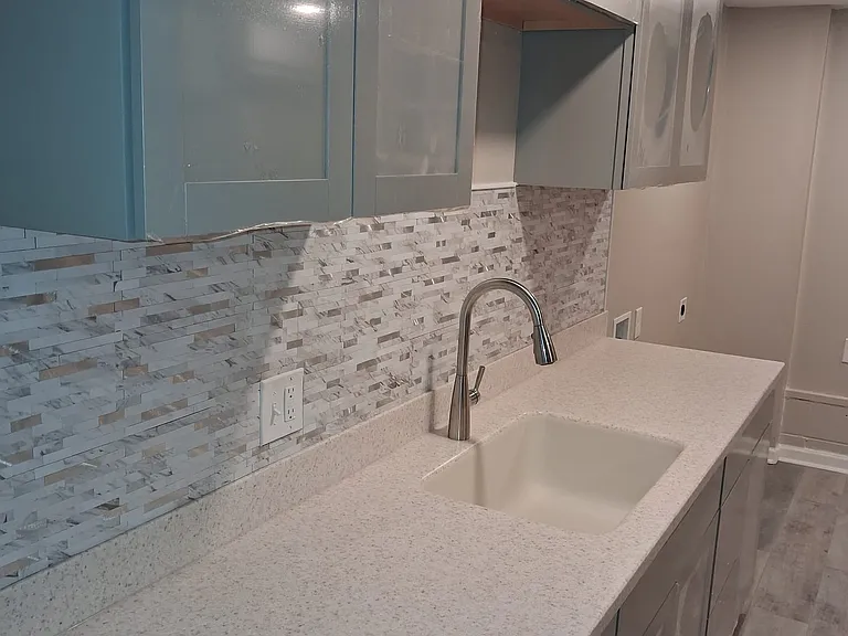 New kitchen cabinet along with new counter and faucet