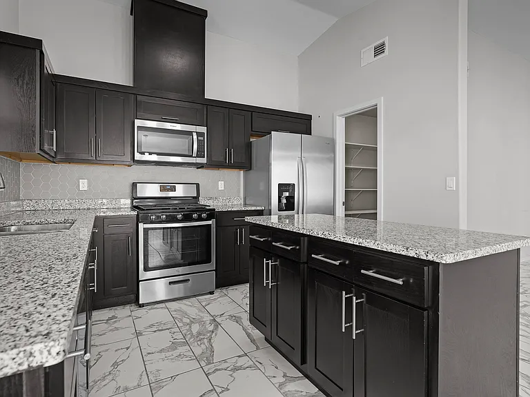 kitchen with central island and granite countertops