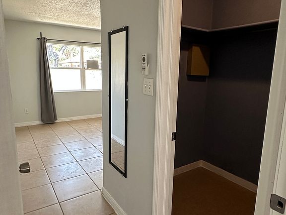 Master bedroom with a walk in closet