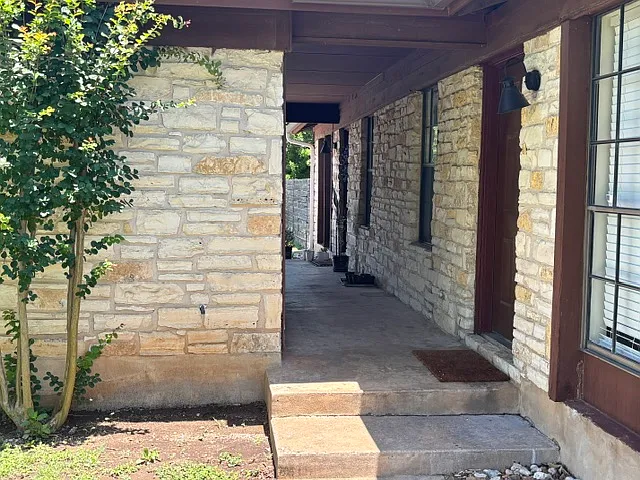 Breezeway between carport and entry to Unit B.