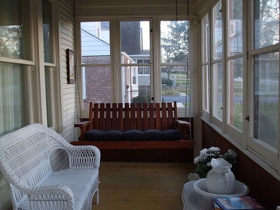 Sunny enclosed front porch
