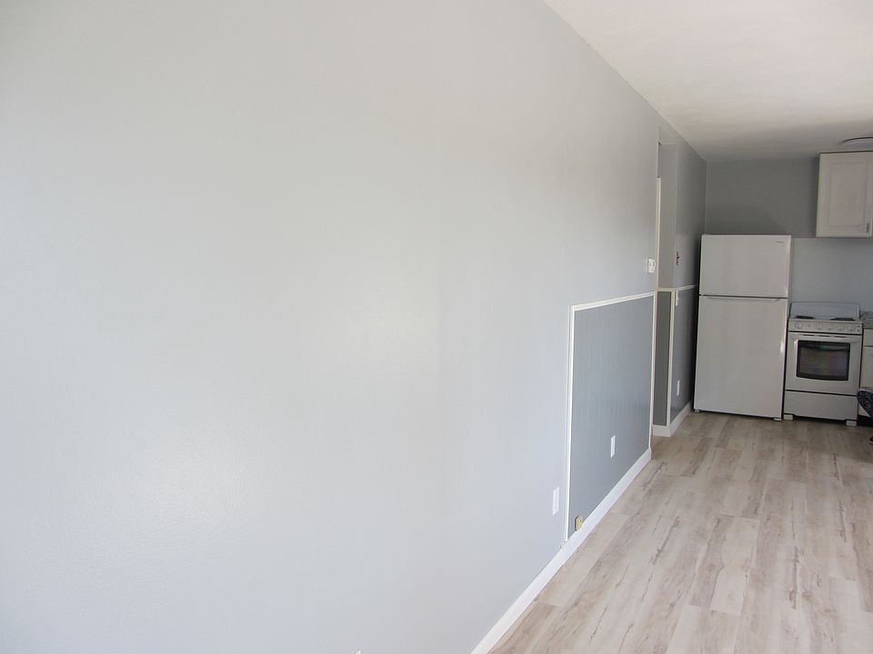 Another angle of the living room looking into the kitchen.