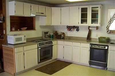 Roomy kitchen has plenty of cabinet and counter space.