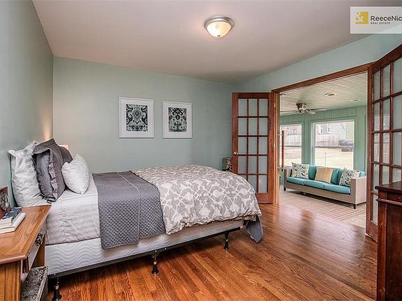 Master bedroom has hardwood floors and French doors which open to all season sunroom.