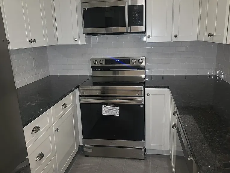Kitchen with all new cabinets ,appliances and flooring