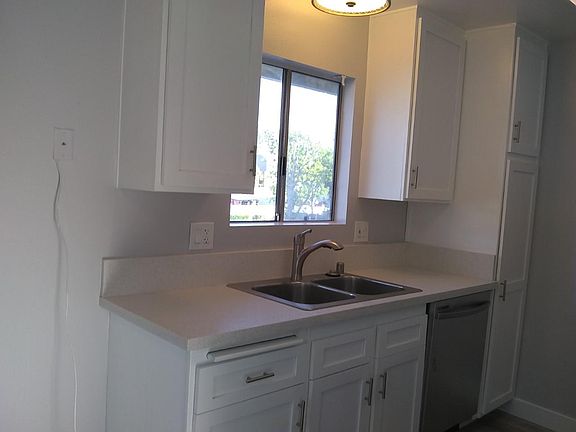 updated kitchen: new QUARTZ counters, new stainless dishwasher. New sink, faucet, lighting, hardware.
