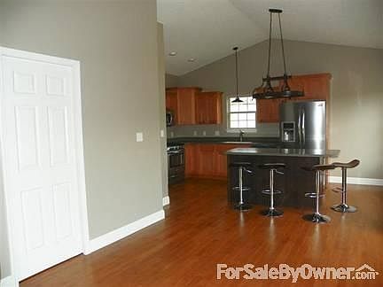 Island Kitchen with Corian Counters
						:
						Island and room for breakfast table - fun place to get together