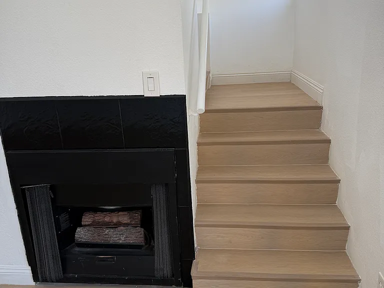 Fireplace in Living Room/Stairs