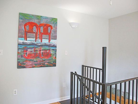 A spiral staircase leads downstairs