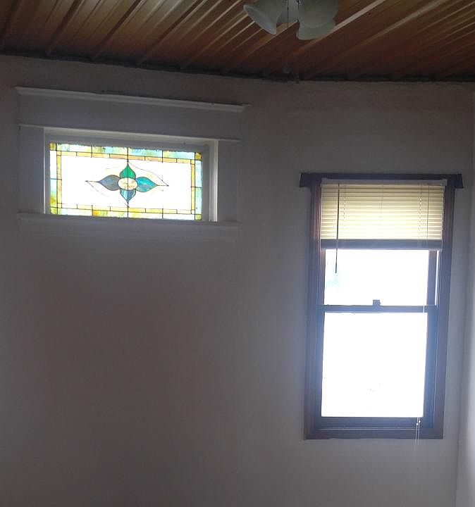 Dining room with stained glass and new tin ceiling