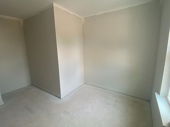 Primary bedroom walk-in closet