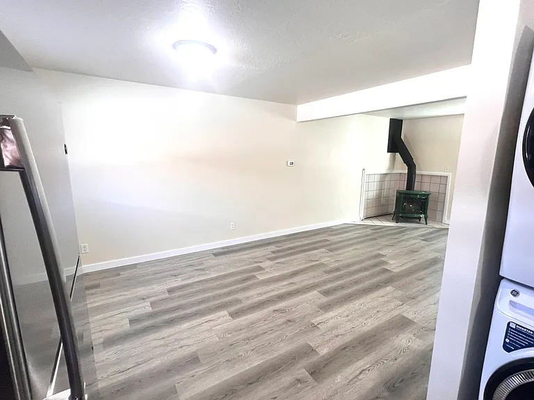 Standing in kitchen looking into dining and main room