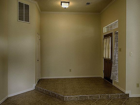 Raised Foyer with coat closet.