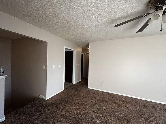 living area and entry to kitchen / bedrooms