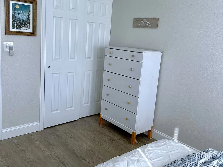 Private bedroom with queen bed and closet/dresser for clothing