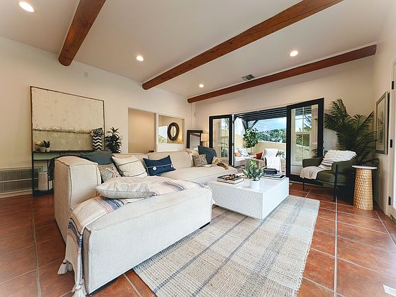 surrounded by glass doors, patios, ligh and views