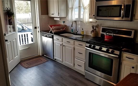 Kitchen with door to yard.