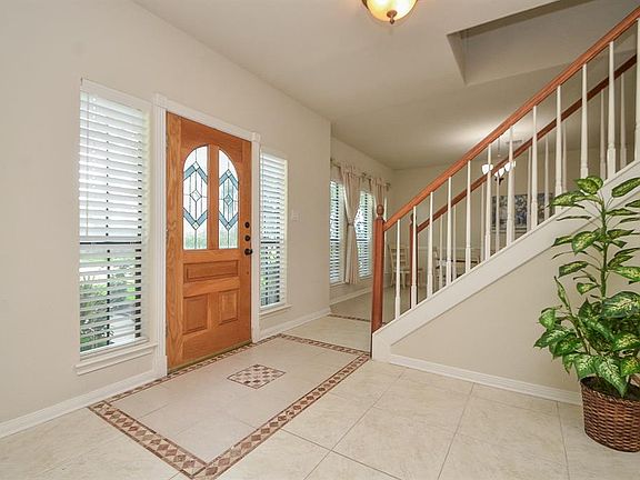 The sunlight floods into this beautiful entry! With a gorgeous glass door and sidelight windowsâyouâll be proud to welcome your guests into this cheerful foyer.