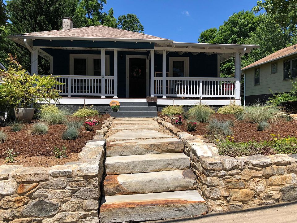 Low maintenance landscaping, new stone wall & walkway.