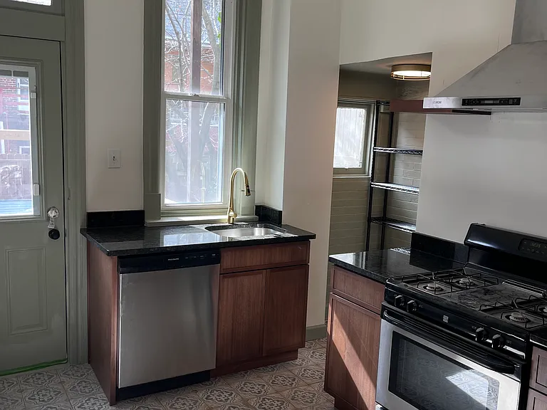 Door to left of sink and dishwasher leads to the backyard