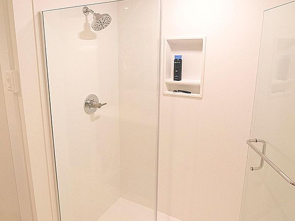 Bathroom features a custom walk-in shower!