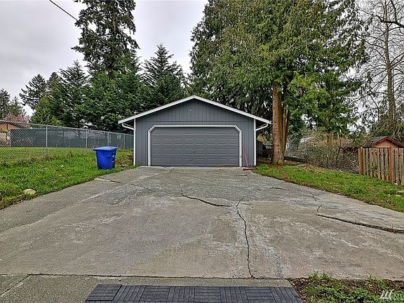 2 car garage located in the back of home. 