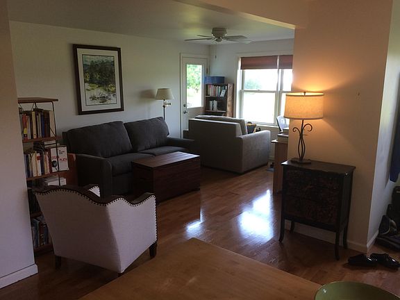 Living room w daybed/couch, 2nd exit door, windows to west.