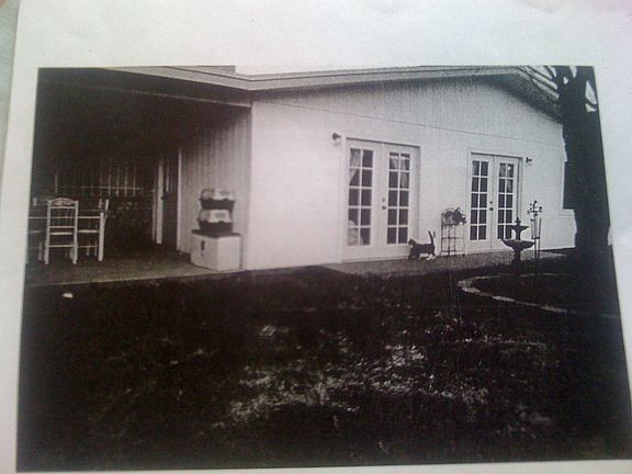 Rear view with covered proch french doors.