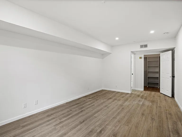 Bedroom with Walk-In Closet with Built-In Organizers