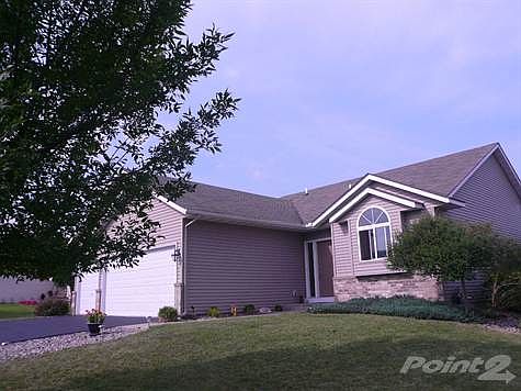 Recently painted garage doors, seal coated driveway, manicured shrubs too.  Great three car garage with storage in the attic too!