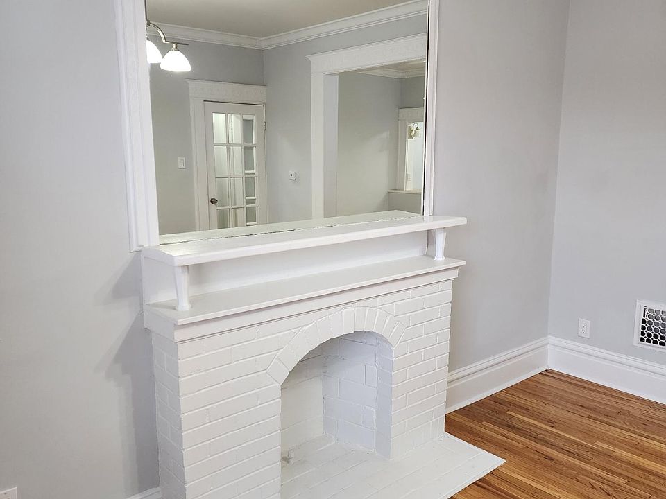Decorative Fireplace with mirror in front room.