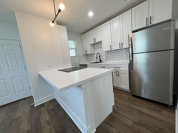 Large countertop island is designed to be dining area.