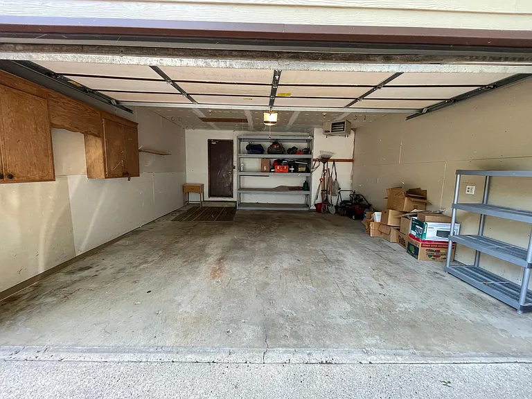 Garage with rack for extra storage space.