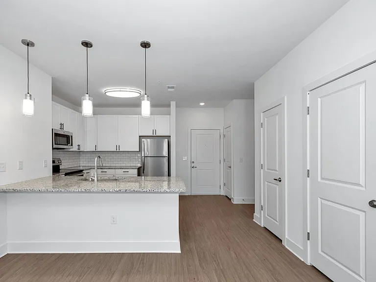 Kitchen with white cabinets and stainless steel appliances