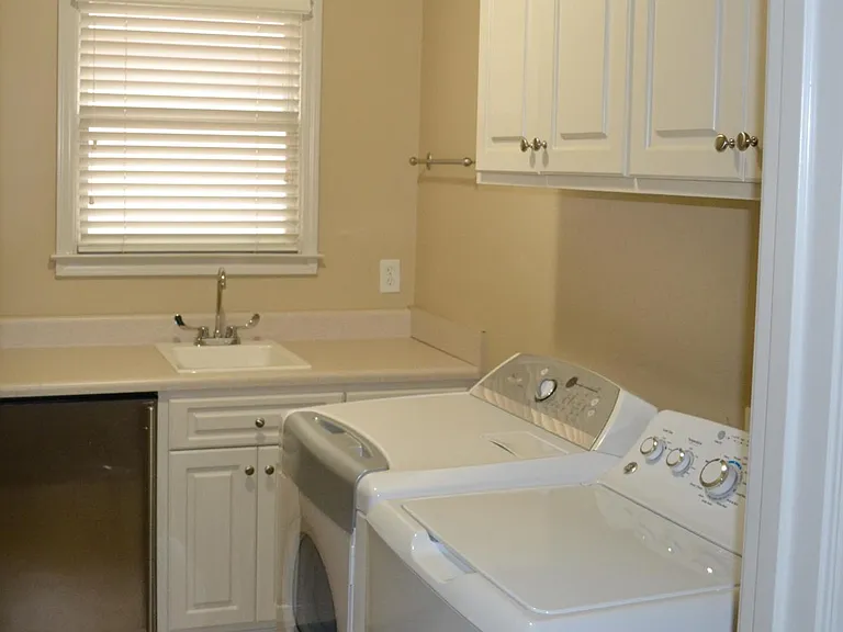 Laundry room includes WD and sink