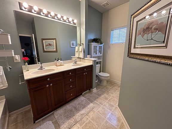 Spacious (wheelchair accessible) tub + shower bathroom with 2 vanities.