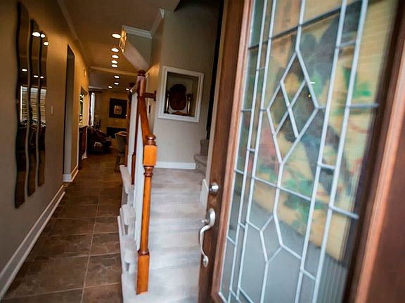 As you open the front door, you can view the walkway to the living area.