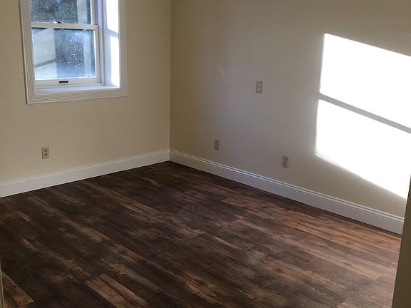 bedroom with sunny window overlooking the cherry tree/front yard
