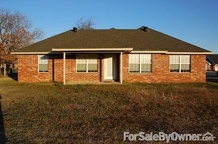 Back view of home
						:
						Large backyard for growing family with space to play and covered back porch.