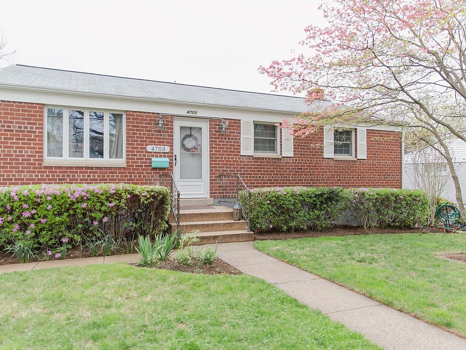 Front of home with flowering Dogwood tree.