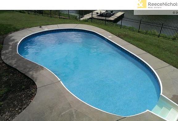 Gorgeous SWIMMING POOL overlooks the lake.