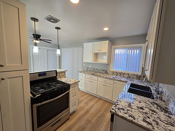Beautiful new kitchen with dishwasher, new cabinets and custom granite counters