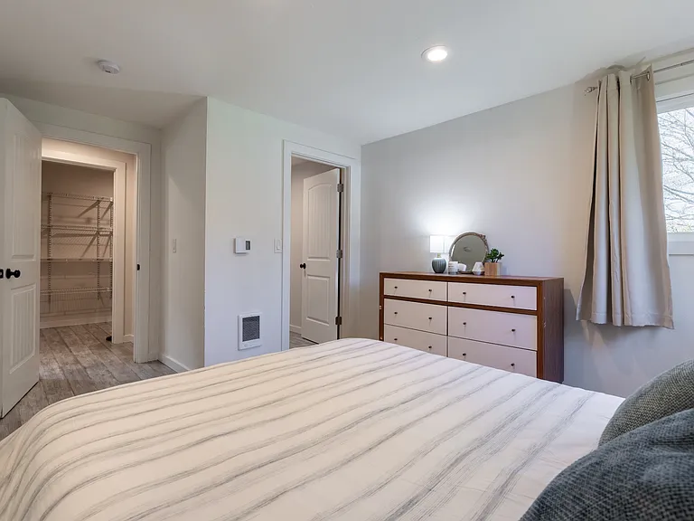 Primary Bedroom, Queen size bed, dresser, walk in closet