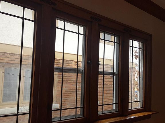 Leaded windows add vintage charm character to the dining roo