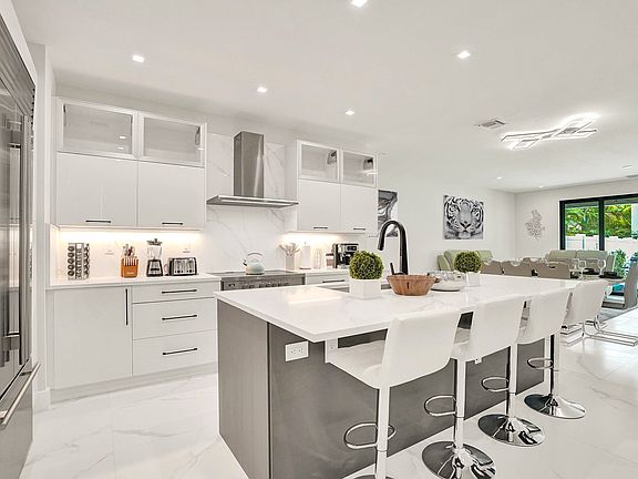 The modern, gourmet kitchen comes fully equipped with everything you could need